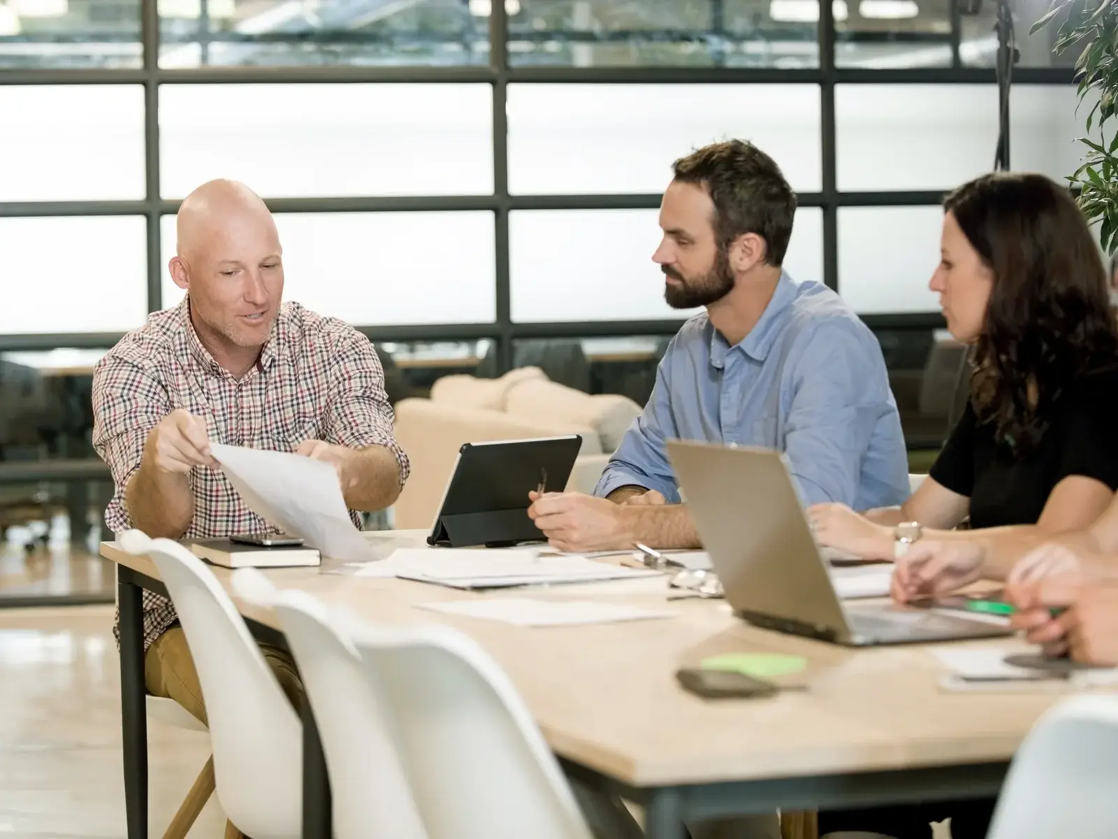 IT Works team working together around one table
