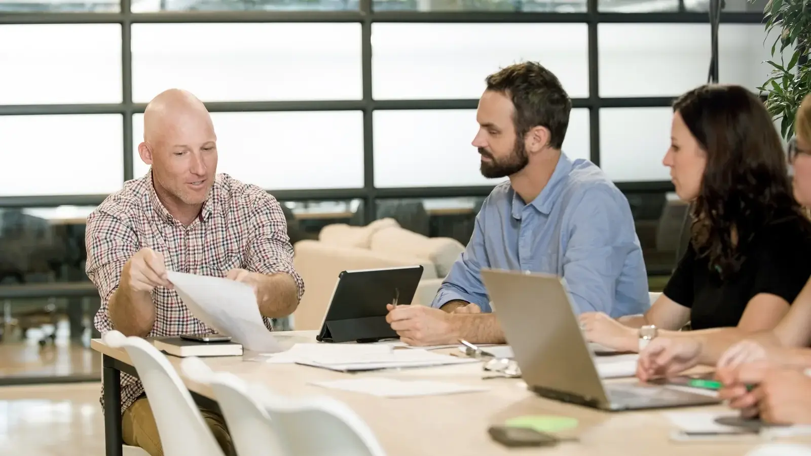 IT Works team working together around one table